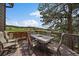 Outdoor deck providing seating and scenic views, perfect for relaxing and entertaining guests at 7082 Silverhorn Dr, Evergreen, CO 80439