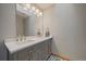Bathroom featuring decorative tile flooring and a double vanity with modern fixtures and storage at 7082 Silverhorn Dr, Evergreen, CO 80439