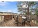 Outdoor deck area with seating, perfect for enjoying the peaceful view of the surrounding landscape at 7082 Silverhorn Dr, Evergreen, CO 80439