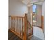 Bright entryway featuring staircase, large window, and stylish pendant light at 7082 Silverhorn Dr, Evergreen, CO 80439