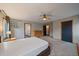 Spacious main bedroom with carpet, ceiling fan, natural light, and neutral walls at 7082 Silverhorn Dr, Evergreen, CO 80439
