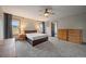 Spacious main bedroom with carpet, ceiling fan, natural light, and neutral walls at 7082 Silverhorn Dr, Evergreen, CO 80439