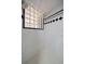 Bathroom shower featuring glass-block window and patterned tile at 7082 Silverhorn Dr, Evergreen, CO 80439
