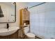 Well-lit bathroom offers a storage cabinet, modern fixtures, and stylish decor, perfect for relaxation at 1010 S Newton St, Denver, CO 80219