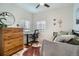 Bedroom featuring a desk, chair, and dresser, offers a comfortable and versatile living space at 1010 S Newton St, Denver, CO 80219