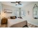 Comfortable bedroom with neutral tones, natural light, and simple decor provides a relaxing space at 1010 S Newton St, Denver, CO 80219