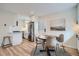 Inviting dining area featuring modern decor, a stylish table, and ample natural light at 1010 S Newton St, Denver, CO 80219