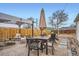 Outdoor patio area with dining set, lounge furniture, and a canopy for shade at 1010 S Newton St, Denver, CO 80219