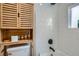 Bright bathroom shower featuring sleek subway tile, a rainfall showerhead, and modern fixtures at 1010 S Newton St, Denver, CO 80219