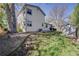 Large backyard, featuring lawn, landscaping, and a storage shed at 14867 E Pacific Pl, Aurora, CO 80014