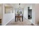 Bright dining room with modern light fixture, and large window at 14867 E Pacific Pl, Aurora, CO 80014