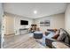Inviting office/living space with a comfortable seating, desk, and tv at 14867 E Pacific Pl, Aurora, CO 80014