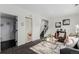 Comfortable living room featuring plush seating, a glass coffee table, and bright natural light at 19454 E Florida Pl, Aurora, CO 80017