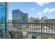 Apartment balcony view showcasing the surrounding downtown buildings on a sunny day at 1700 Bassett St # 1301, Denver, CO 80202
