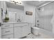 Modern bathroom features white vanity with chrome fixtures, tub/shower combo and decorative lighting at 1700 Bassett St # 1301, Denver, CO 80202