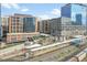 Apartment complex overlooking a train station with cityscape views at 1700 Bassett St # 1301, Denver, CO 80202
