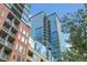 Modern, high-rise apartments with glass and brick exterior, offering city living with balconies and views at 1700 Bassett St # 1301, Denver, CO 80202