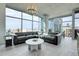 Bright, open living area with floor-to-ceiling windows and comfortable seating arrangement with city views at 1700 Bassett St # 1301, Denver, CO 80202