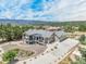 Stunning aerial view of a modern home with lush landscaping and a mountain backdrop, offering privacy and curb appeal at 670 Portland Rd, Monument, CO 80132