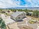 Aerial view of a home with three car garage, large driveway and drought-resistant landscaping at 670 Portland Rd, Monument, CO 80132