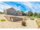 An expansive backyard with decorative landscaping, shrubbery, and healthy green vegetation at 670 Portland Rd, Monument, CO 80132