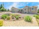 The expansive backyard has drought tolerant landscaping, shrubbery, and healthy green vegetation at 670 Portland Rd, Monument, CO 80132