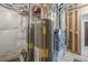 Basement utilities featuring two hot water heaters and a modern furnace system at 670 Portland Rd, Monument, CO 80132