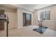 Finished basement gym with carpet, sliding doors, and natural light from egress window at 670 Portland Rd, Monument, CO 80132