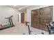 A spacious finished basement gym with carpet and convenient access to sliding door closet at 670 Portland Rd, Monument, CO 80132
