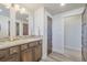 Well-lit bathroom featuring a single sink vanity, decorative backsplash and a private toilet room at 670 Portland Rd, Monument, CO 80132