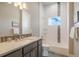 Bathroom features a tub/shower combo with modern vanity and fixtures at 670 Portland Rd, Monument, CO 80132