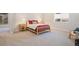 Cozy bedroom with wood bed frame, bedside tables and overhead lighting at 670 Portland Rd, Monument, CO 80132