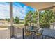 Inviting covered patio with outdoor seating offers picturesque views of the surrounding landscape and greenery at 670 Portland Rd, Monument, CO 80132