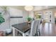 Charming dining area with backyard view, accentuated by modern decor, natural light, and hardwood floors at 670 Portland Rd, Monument, CO 80132