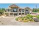 Stunning single Gathering home featuring a large outdoor patio, landscaping, and drought tolerant yard at 670 Portland Rd, Monument, CO 80132