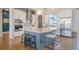 Modern kitchen featuring granite countertops, stainless steel appliances, a spacious island, and stylish pendant lighting at 670 Portland Rd, Monument, CO 80132