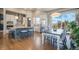 Modern kitchen boasts stainless steel appliances, an island with seating, and hardwood floors at 670 Portland Rd, Monument, CO 80132