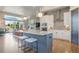 Open concept layout featuring a modern kitchen, breakfast bar, and seamless flow into the living area at 670 Portland Rd, Monument, CO 80132