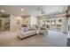 Spacious living room with wet bar, comfortable seating and access to the outdoor patio area at 670 Portland Rd, Monument, CO 80132