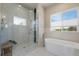 View of the Main Bathroom with marble shower, stand alone tub and large view window at 670 Portland Rd, Monument, CO 80132