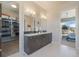 Main Bathroom with double sinks, closet and access to bedroom with sliding door at 670 Portland Rd, Monument, CO 80132