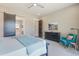 View of Main Bedroom with turquoise chair and art on the wall, and entry to main bathroom at 670 Portland Rd, Monument, CO 80132