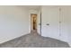 Bedroom with carpeted floors, a window, and a door leading to an en suite bathroom at 7822 South Kittredge Circle, Englewood, CO 80112