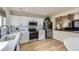 Stylish kitchen featuring white cabinets, stainless steel appliances, and quartz countertops at 7822 South Kittredge Circle, Englewood, CO 80112