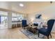 Well-lit living room with an open-concept design and a view of the kitchen at 7822 South Kittredge Circle, Englewood, CO 80112