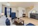 Comfortable living room with a fireplace, wooden floors, and blue accents at 7822 South Kittredge Circle, Englewood, CO 80112