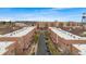 An aerial view of townhomes in a community, with easy access to shopping and restaurants at 5428 Zephyr Ct, Arvada, CO 80002