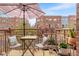 Cozy balcony with seating, table, decor, and views of the surrounding community at 5428 Zephyr Ct, Arvada, CO 80002