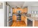 Spacious kitchen with stainless steel appliances and well-lit workspace at 5428 Zephyr Ct, Arvada, CO 80002
