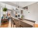 Open-concept living area showcasing dining area, fireplace, and patio access at 5428 Zephyr Ct, Arvada, CO 80002